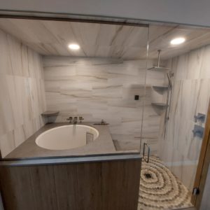 steam shower with 12x24" porcelain tile on the walls