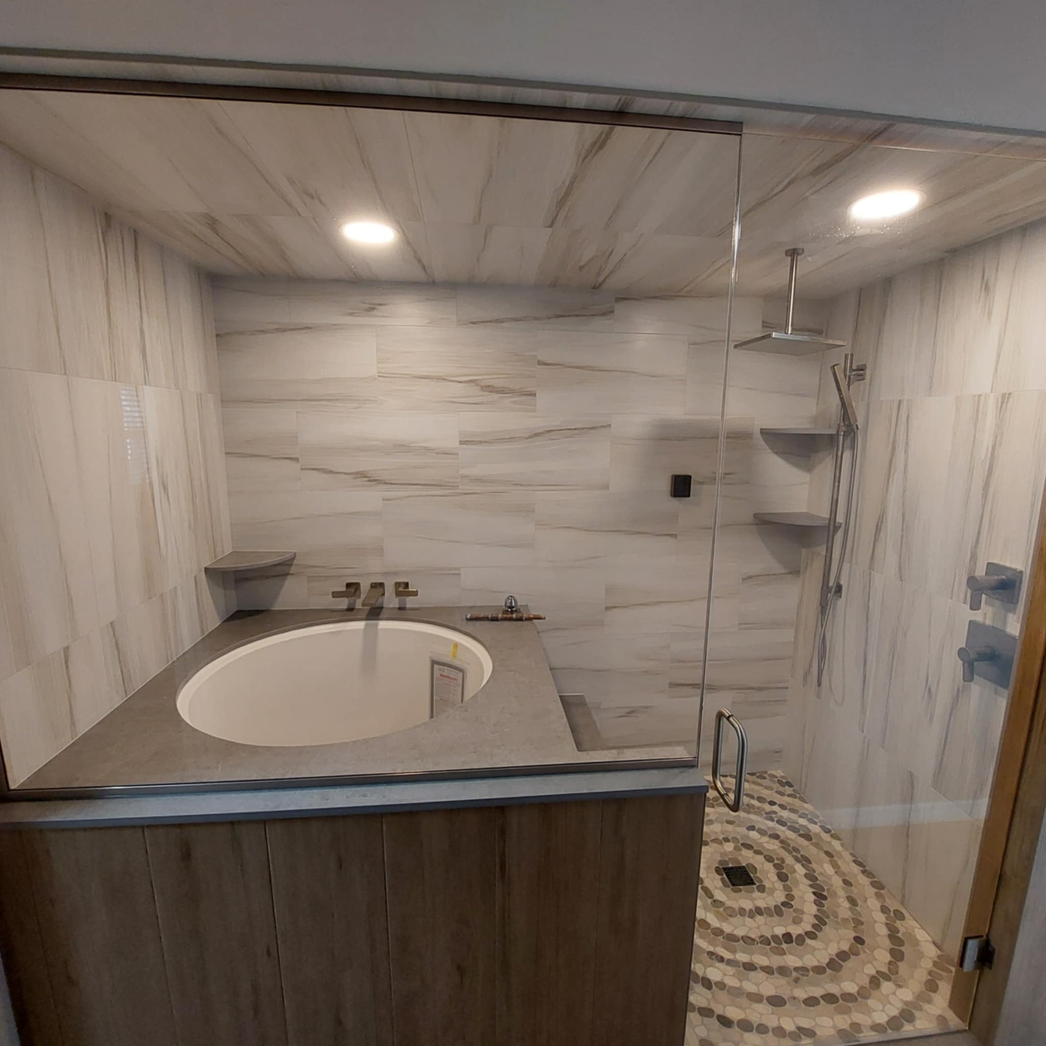 steam shower with 12x24" porcelain tile on the walls